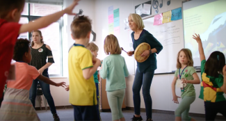 Teacher dancing with students